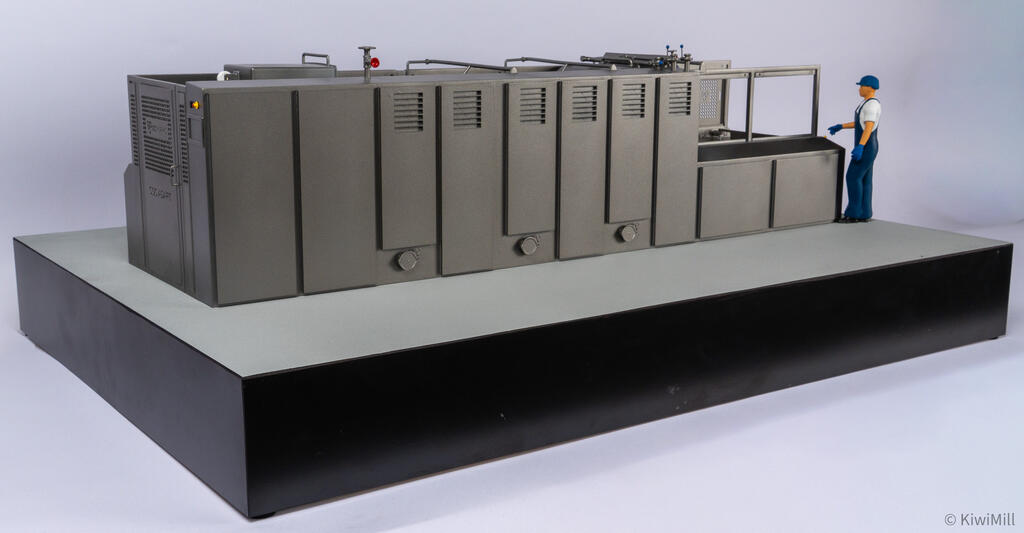 Rear elevation of the cooking line model showing louvered cabinet doors, round drain fittings and worker figure